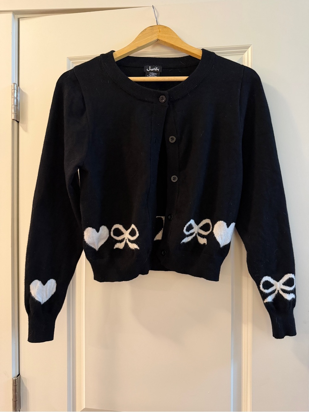 Justify Black Cropped Cardigan with White Heart & Bow Details